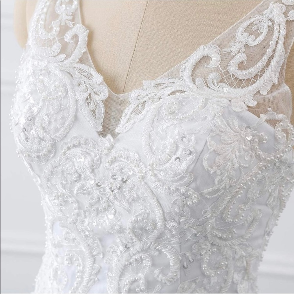 V-neckline. Never worn.